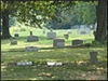 OddFellows Cemetery with gravestones and a shady tree above
