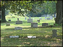 OddFellows Cemetery with gravestones and a shady tree above