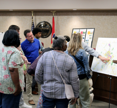 A group of residents share their feedback at a public meeting for the comprehensive growth plan.